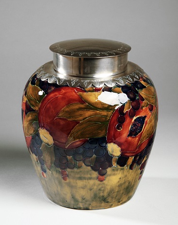 alt="moorcroft ginger jar pomegranate design on pale background"
