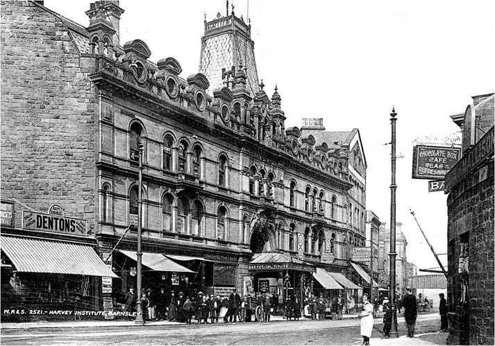 Black and white photograph of the Public Hall with people lined up in front