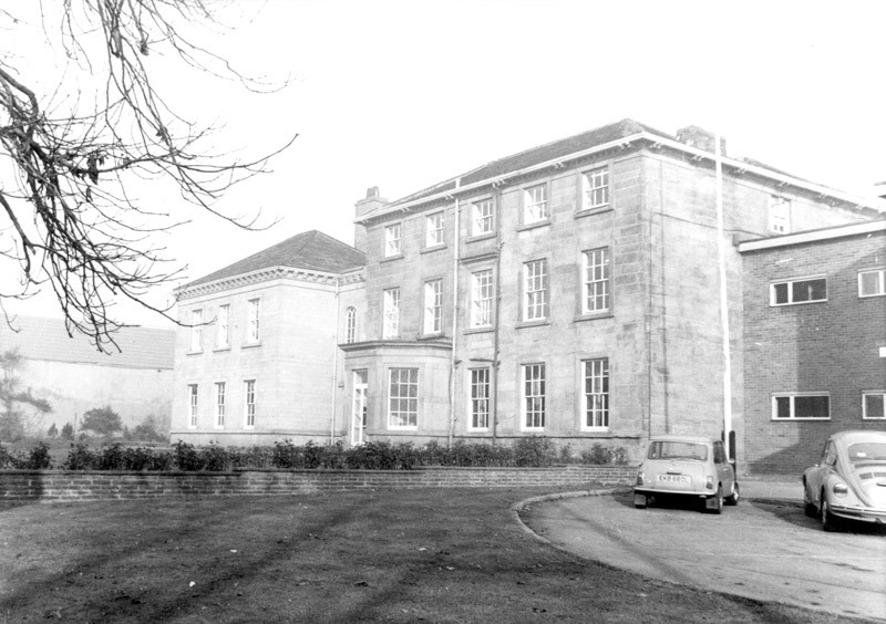 Former Council Offices at Brierley, large historic building with gardens in front. 