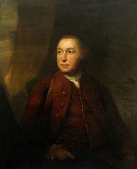 Oil painting of John Stanhope III (1629-1693). This half portrait shows John Stanhope with shoulder length brown hair, wearing a dark jacket buttoned down the front with a square white collar. He is holding a scroll of paper in his hand, partially unrolled. 