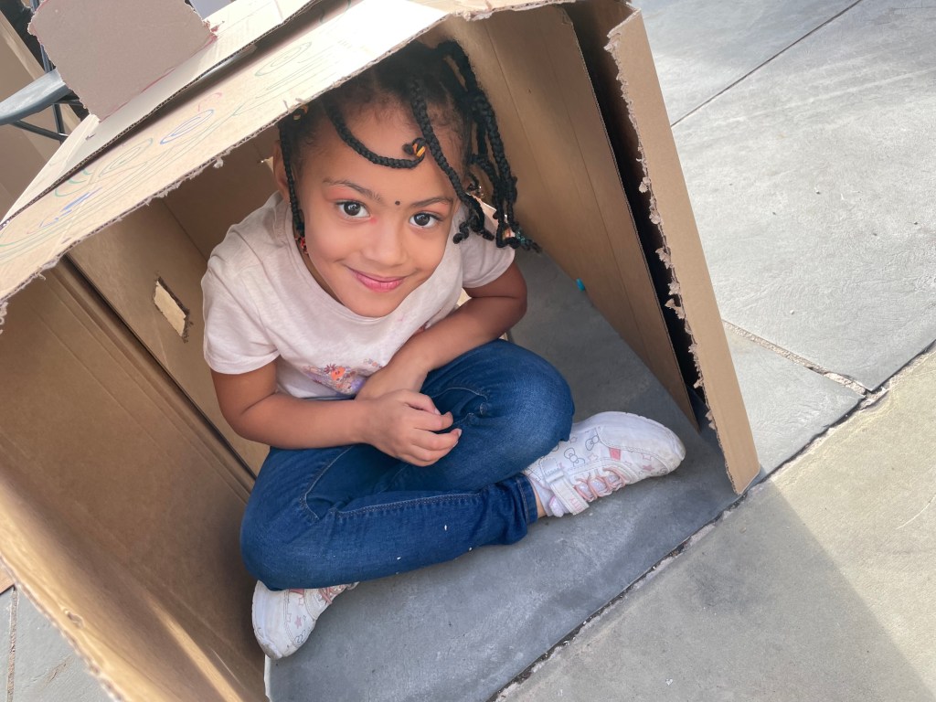 A child in their magical hidey-hole den