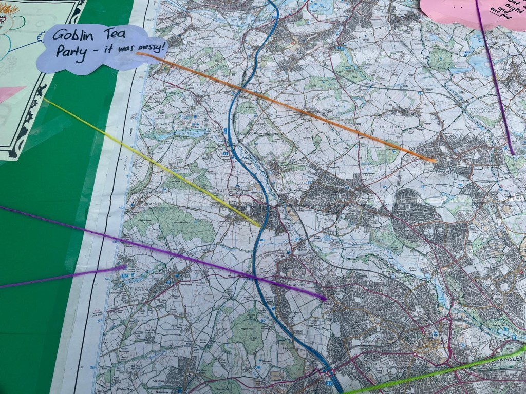 A map of Barnsley with string connecting descriptions of magical sightings across the region. Includes a tag pointing to Royston that says 'Goblin tea party. It was messy.'