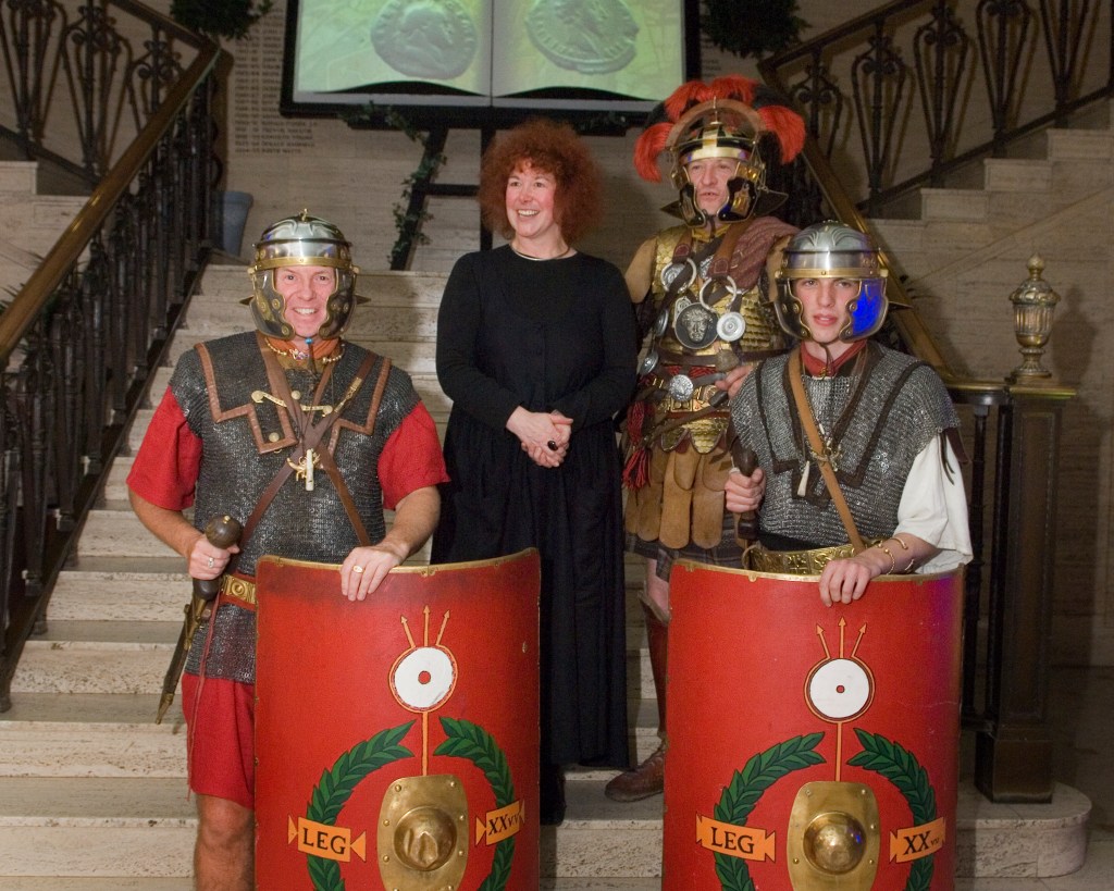 Joann Fletcher surrounded by people in Roman costume