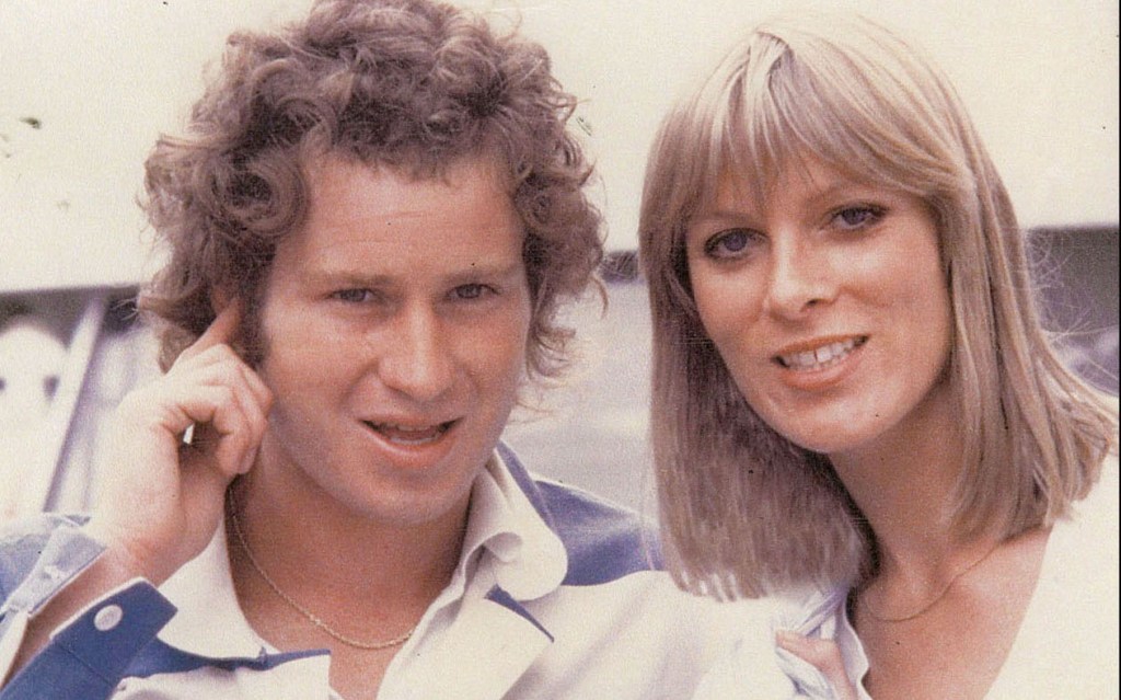 Victoria posing for a photograph with John McEnroe