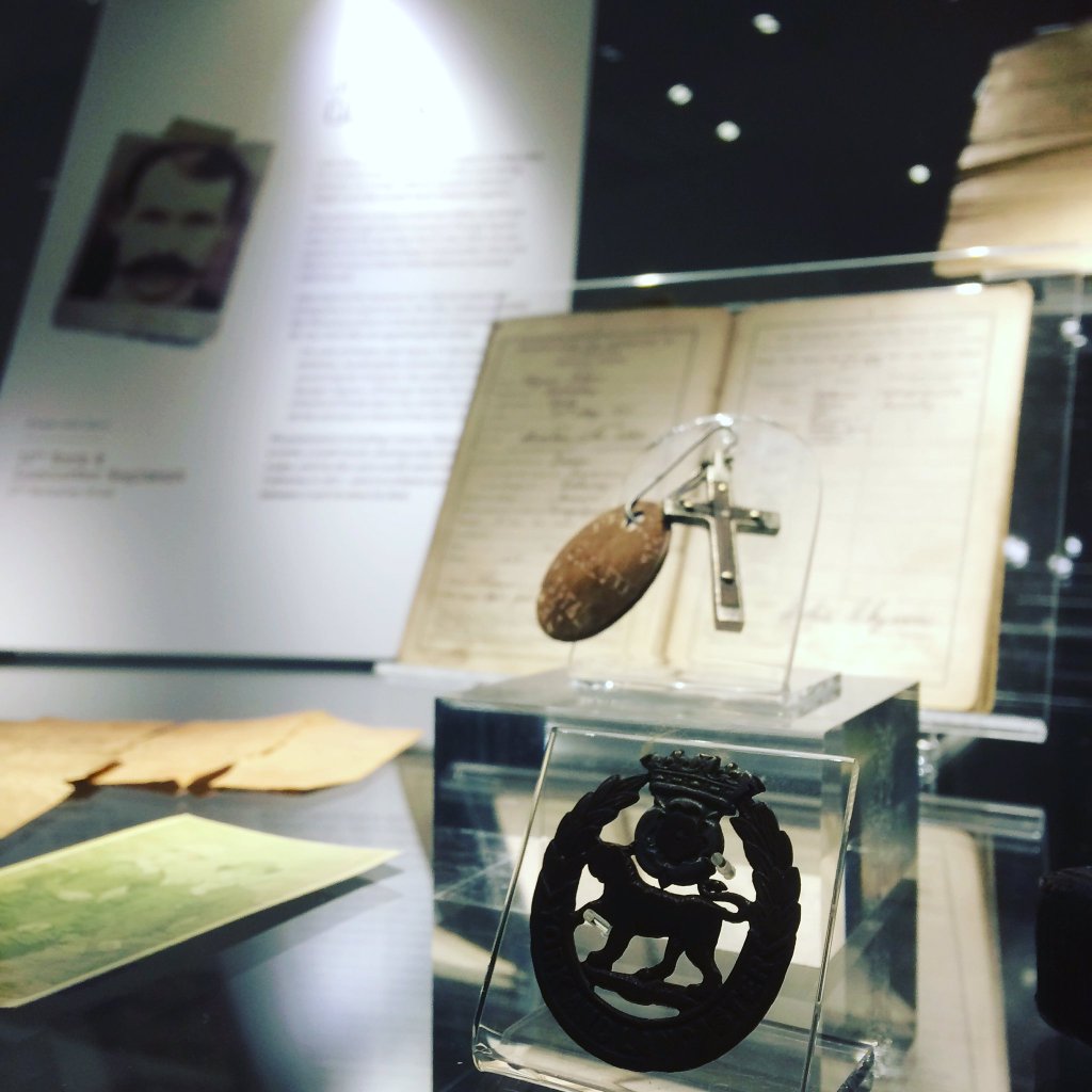 a view of the exhibition including badges and medals