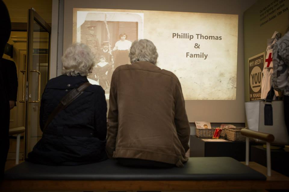 people watching a video in the exhibition