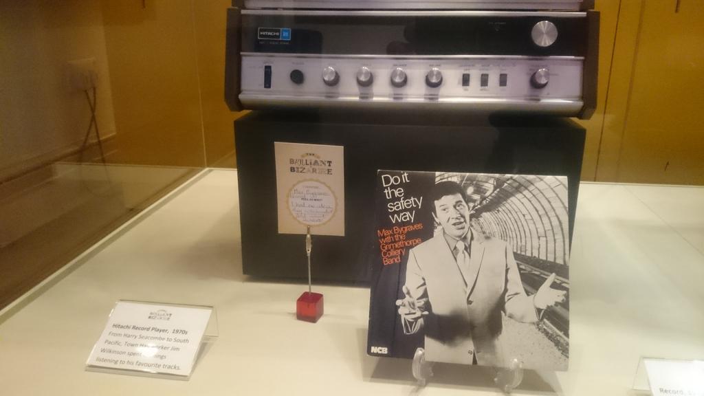 A record player and a record propped up against it