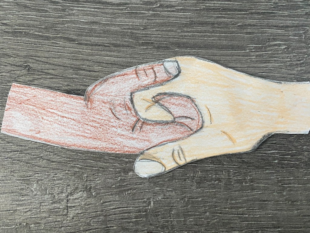 two hand holding on to one another 