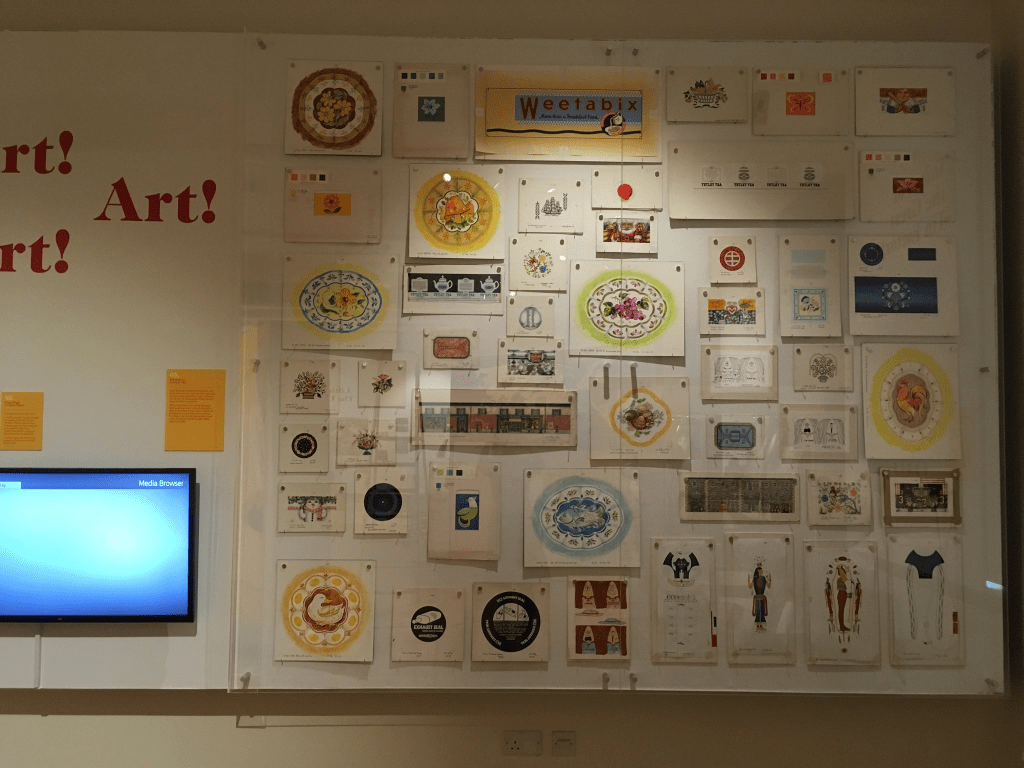 A wall of canister company artwork