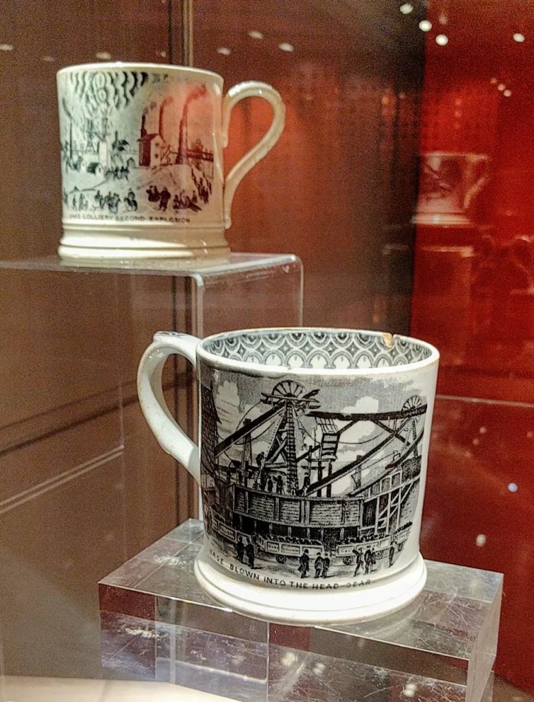 Two commemorative mugs