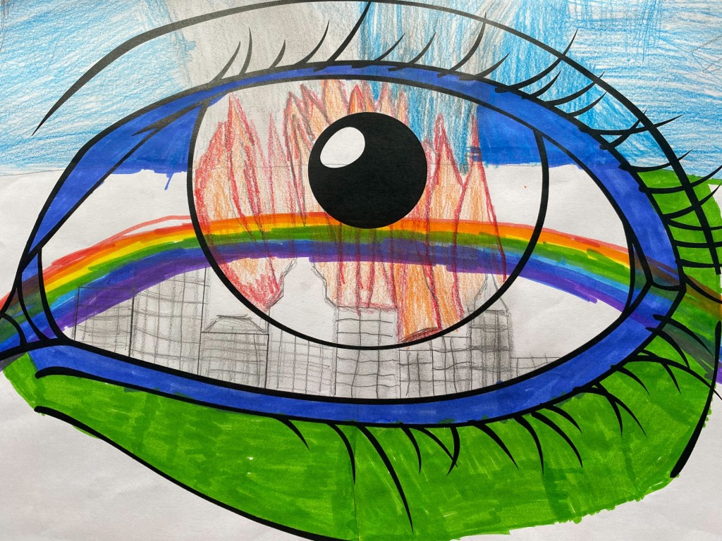 a drawing of an eye with a building in flames