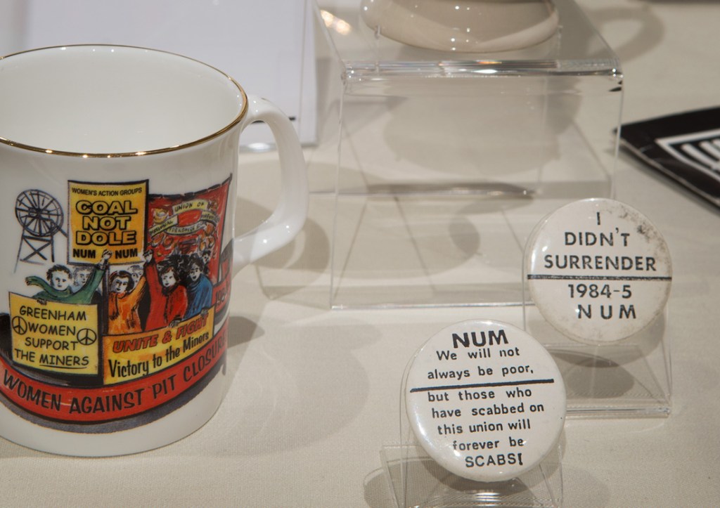 A mug and badge