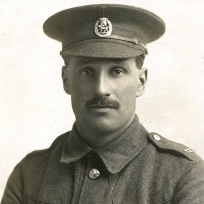 Black and white photograph of Harry Scargill in his regimental uniform. He is looking directly at the camera.