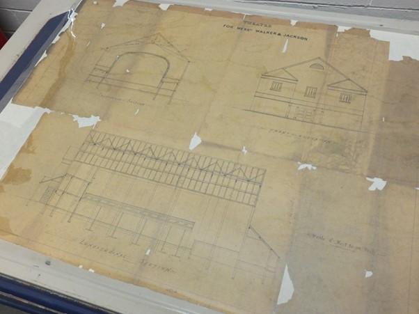 plans for the theatre which are quite damaged around the edges