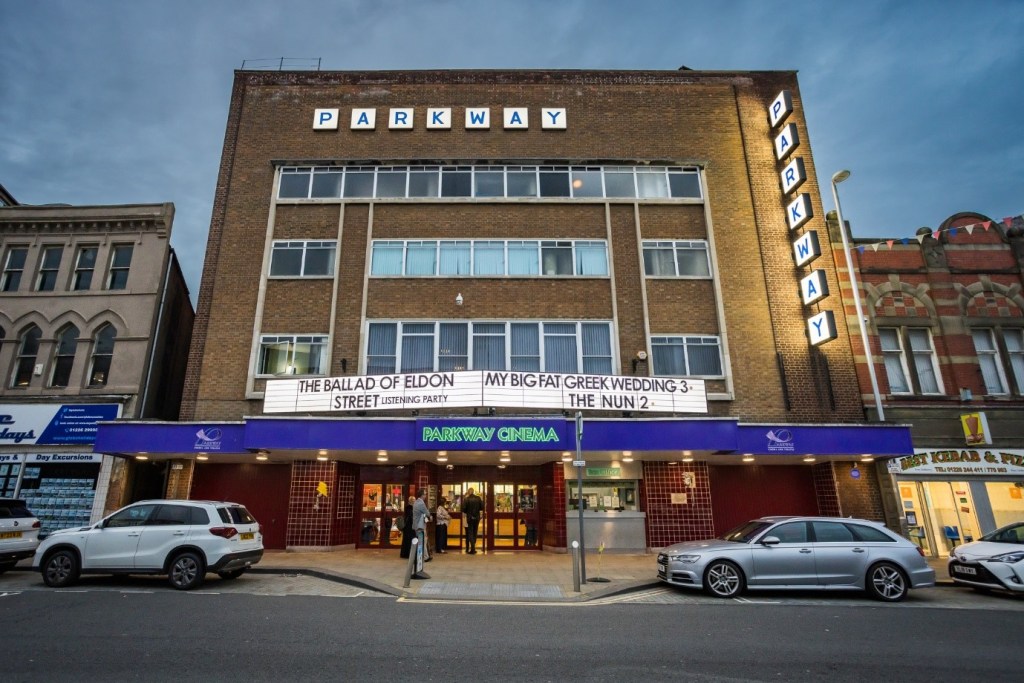 The Parkway lit up in September 2023 advertising The Ballad of Eldon Street Listening Party and My Big Fat Greek Wedding 3 and The Nun 2