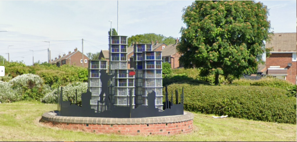 The sculpture dedicated to Stanley which depicts the nearby glassworks and aglassblower 