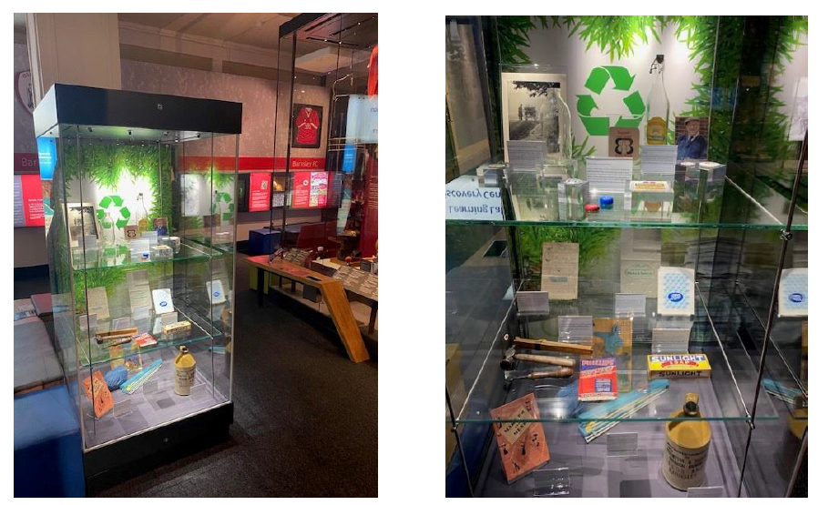 Two views of the sustainability case in the museum including glass bottles, papers bags, leaflets about recycyling 