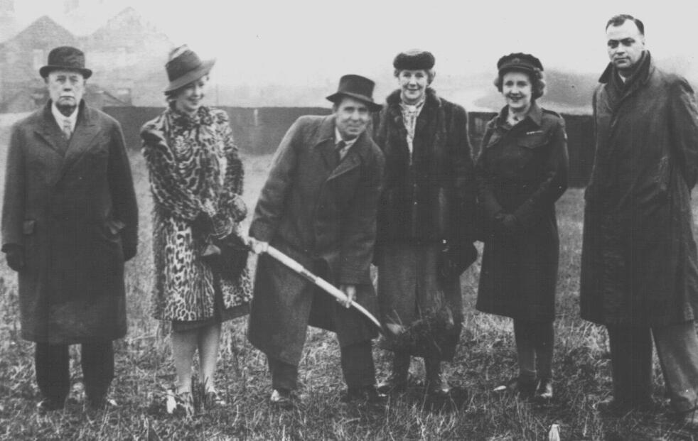 Milton has a spade in his hand as he is surrounded by people as the first sod is cut in Monk Bretton