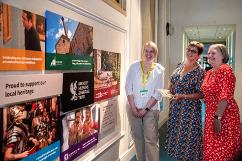 Volunteer showing visitors around Experience Barnsley