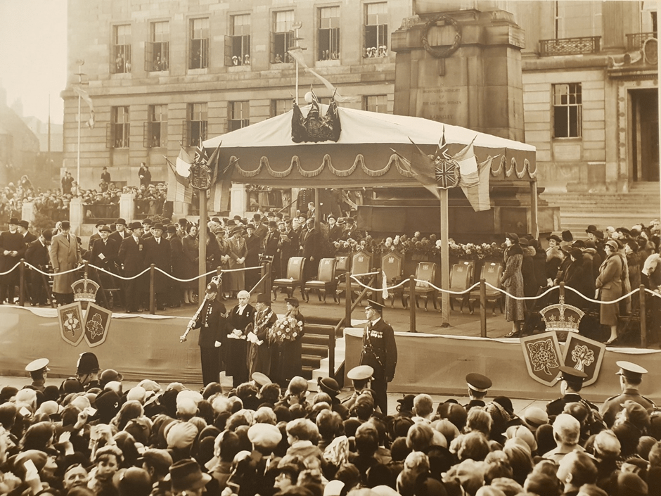 The front of the town hall, crowds gather ahead of the royal visit.
