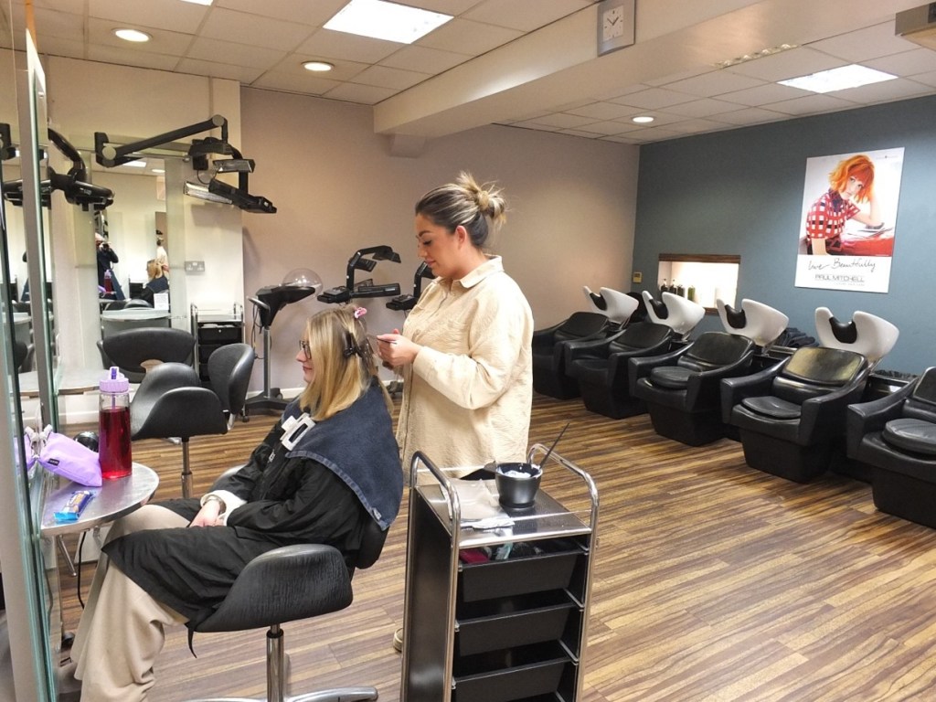 Apprentice colouring hair in the present-day Leslie Frances salon