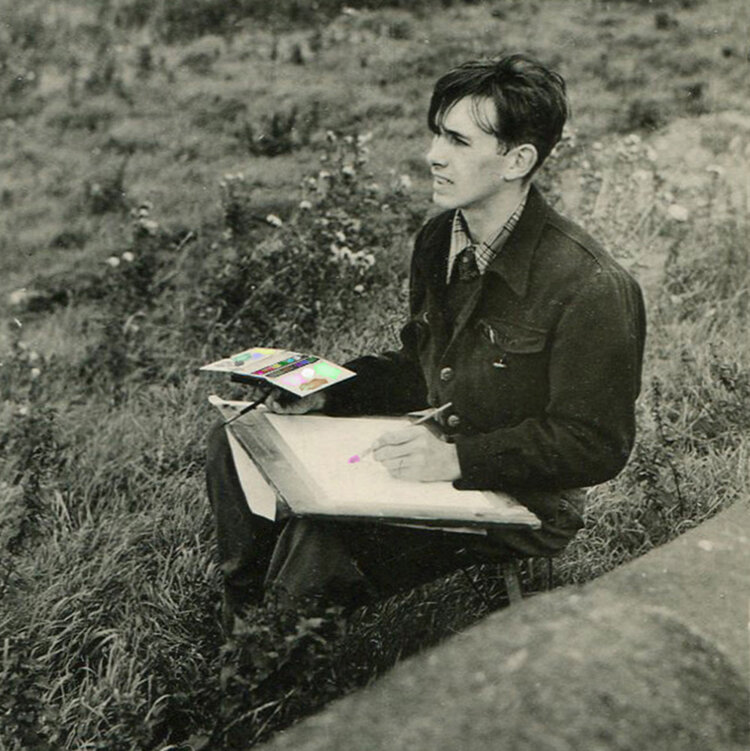 Brian sat in a field painting