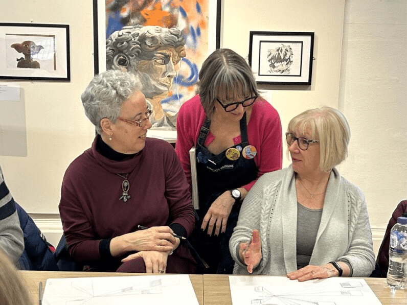 Two people sketching