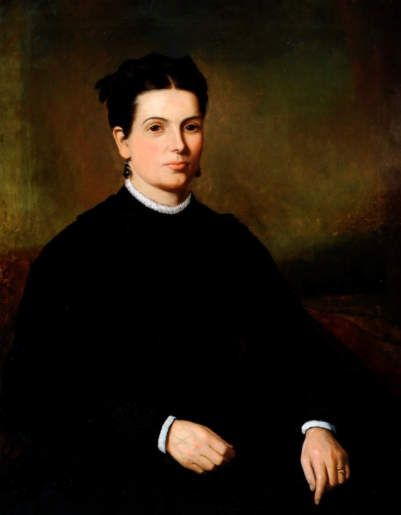 A traditional portrait painting features a woman with dark hair styled in a bun, wearing a dark long-sleeve dress with a white collar and white cuffs. She is seated against a dark, muted background, and her hands rest serenely in her lap.