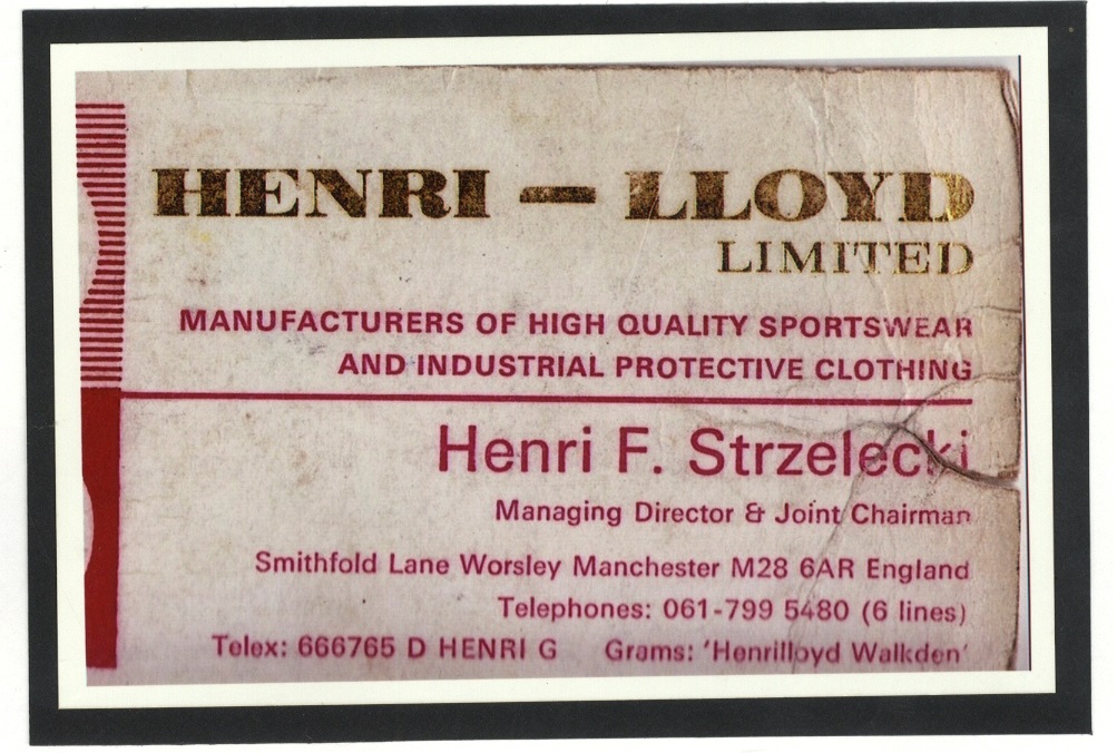 A business card with the heading "Henri-Lloyd Limited." It states the company manufactures high-quality sportswear and industrial protective clothing. The card includes contact information for Managing Director and Joint Chairman Henri F. Strzelecki in Manchester, England.