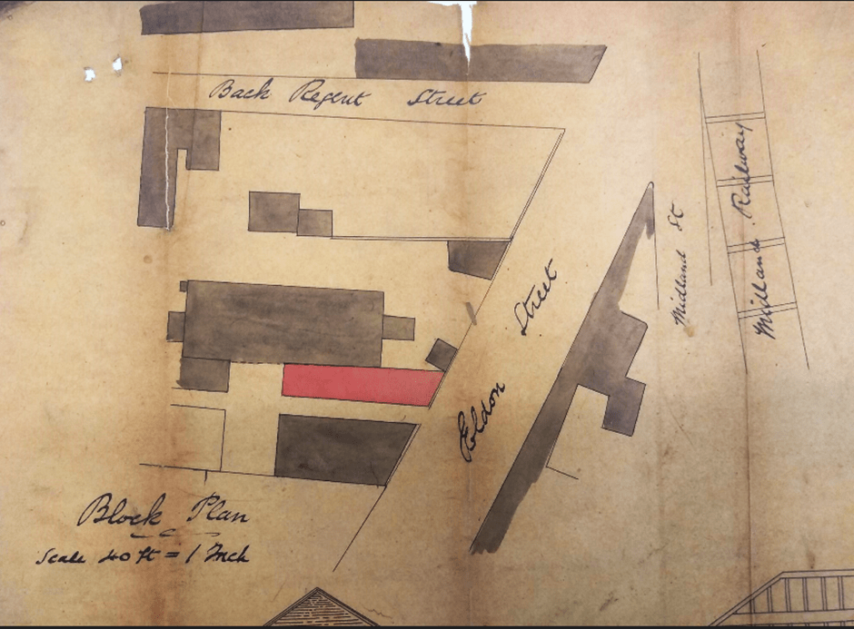 A vintage map shows a block plan with handwritten labels for "Back Regent Street," "Eldon Street," and "Midland Street." Several buildings are depicted in dark shading, with one building highlighted in red. The plan notes the scale as 40ft = 1 inch.