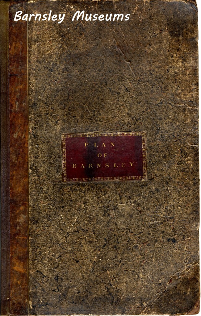 An old, weathered book cover titled "Plan of Barnsley" with a marbled texture and a dark brown spine. The top left displays "Barnsley Museums" in white text.