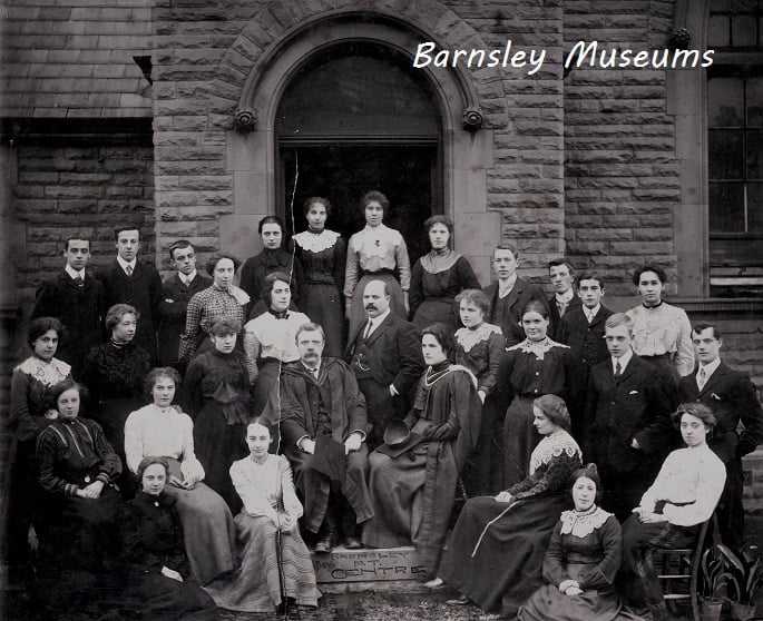 Historical group photograph of individuals outside a building, possibly associated with Barnsley Museums.