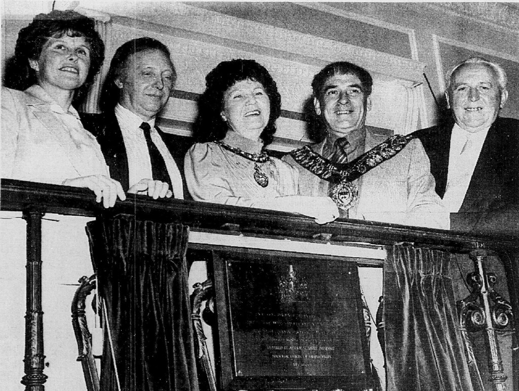 Historical photograph featuring five people on a balcony, with one individual wearing the mayoral chain, likely at a ceremonial event.