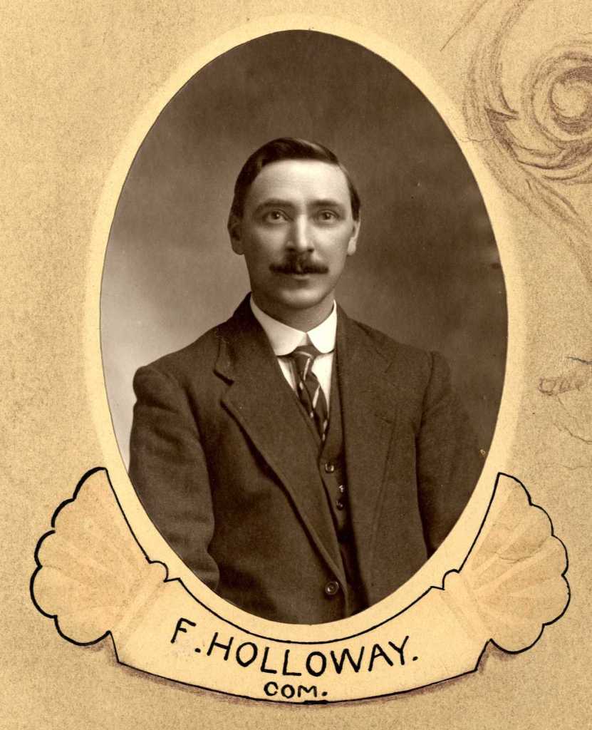 Black and white portrait of a man in formal attire, with a mustache, framed in an oval design with the name 'F. Holloway' at the bottom.