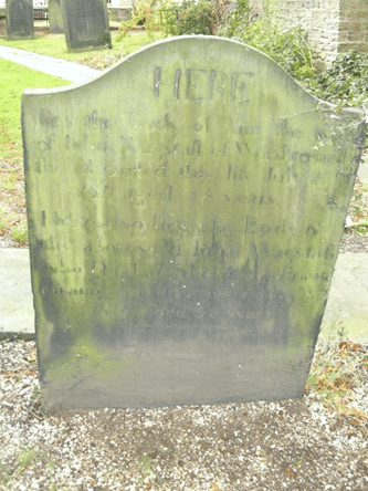 Gravestone of Ann Wagstaff and John Wagstaff, with inscriptions detailing their lives and deaths, located in the churchyard of St. Mary's Church in Worsbrough.